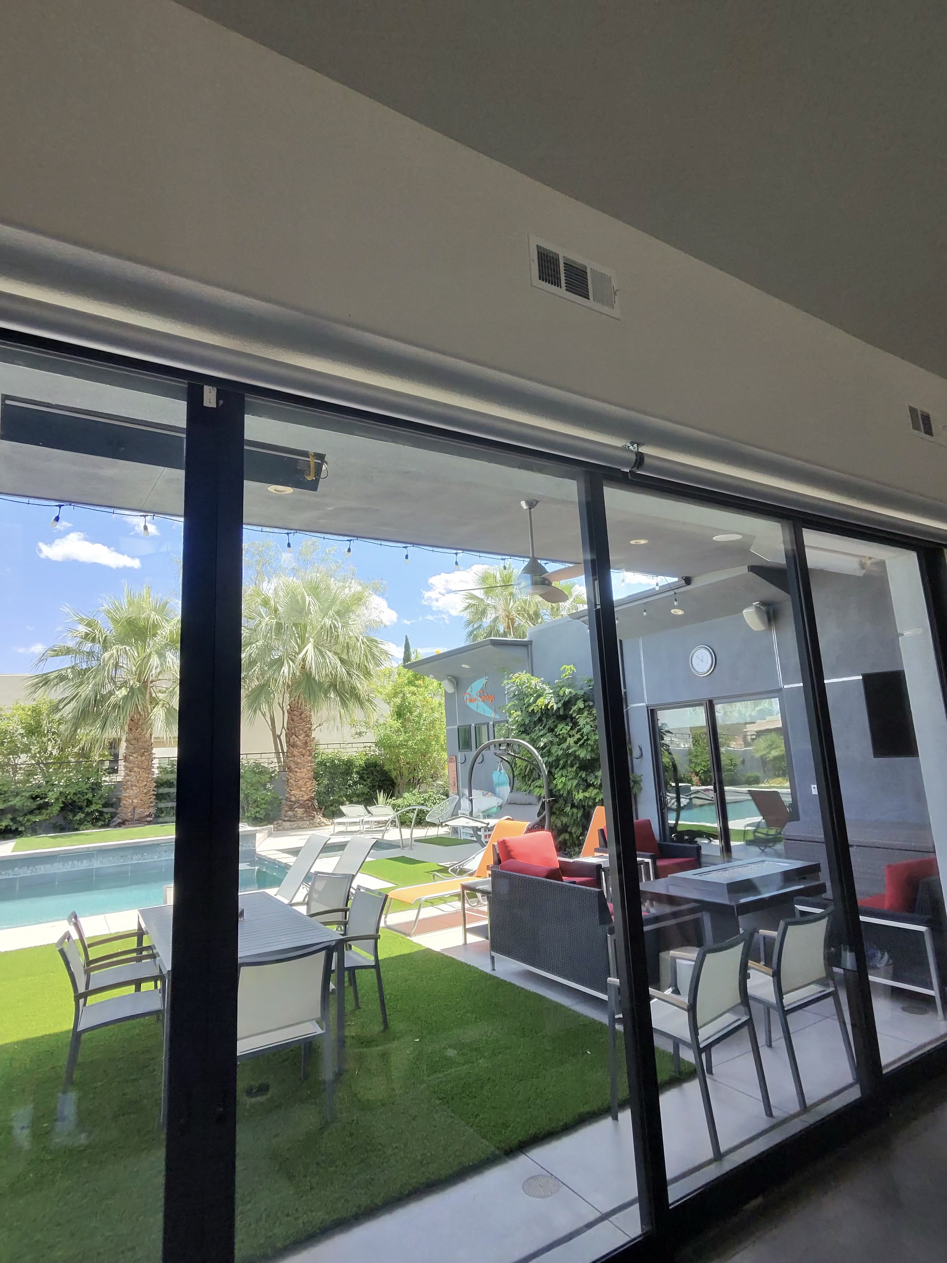 Clean sliding glass doors with pool view