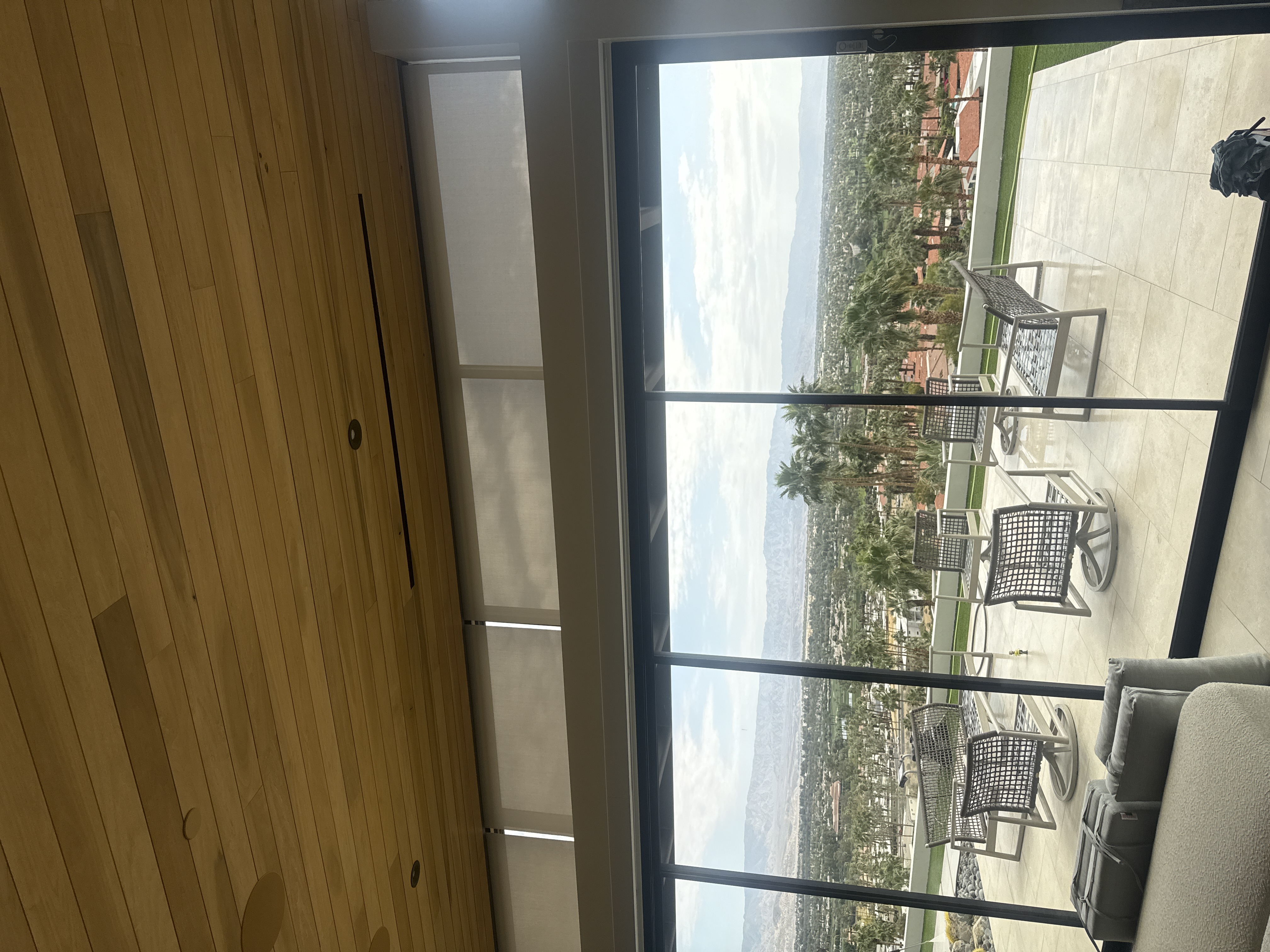 Clean floor-to-ceiling windows with valley view