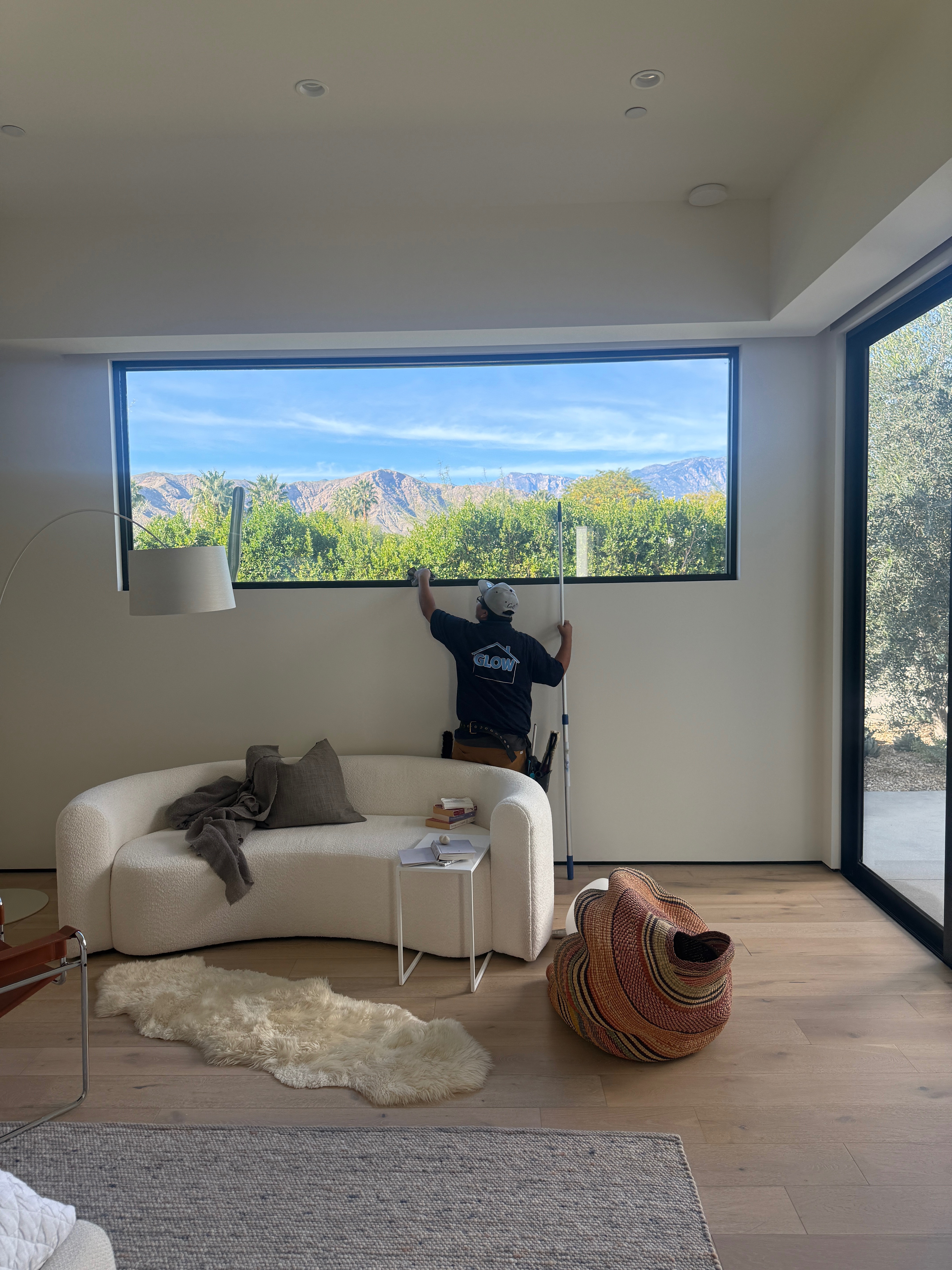Window cleaning in luxury living room